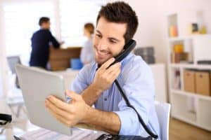 Guy using VoIP in his office