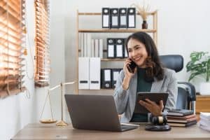 Business woman on the phone using VoIP