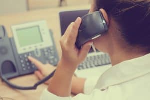 Woman using a business phone